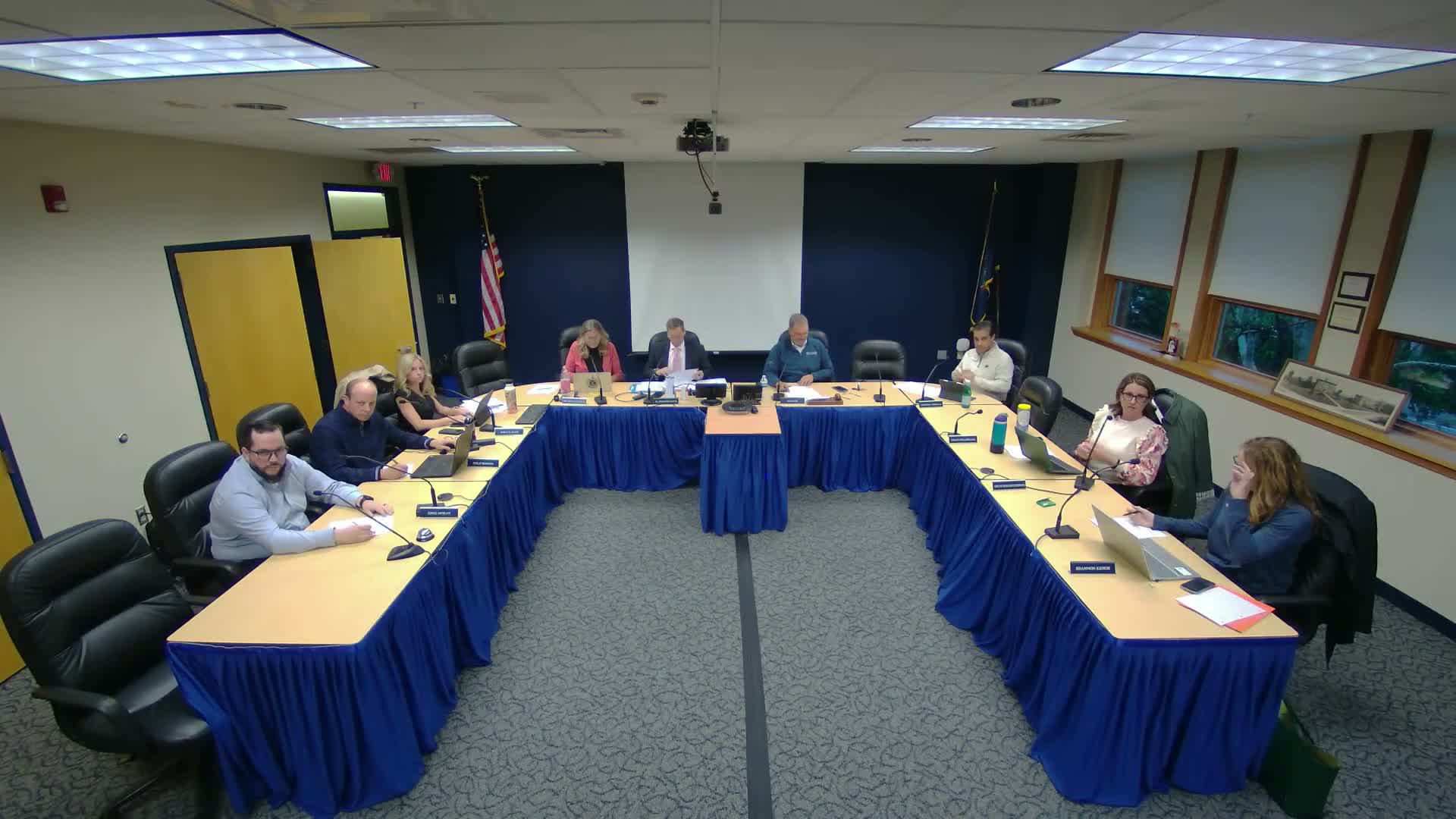 Marching‑band boosters request district pit and secure storage; parent presses district on swim‑coach communication