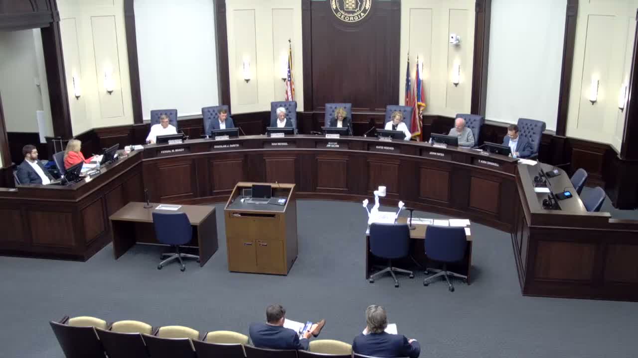 Neighbors press concerns over trees, runoff and changing plans; Planning Commission defers Mayfield Road rezoning
