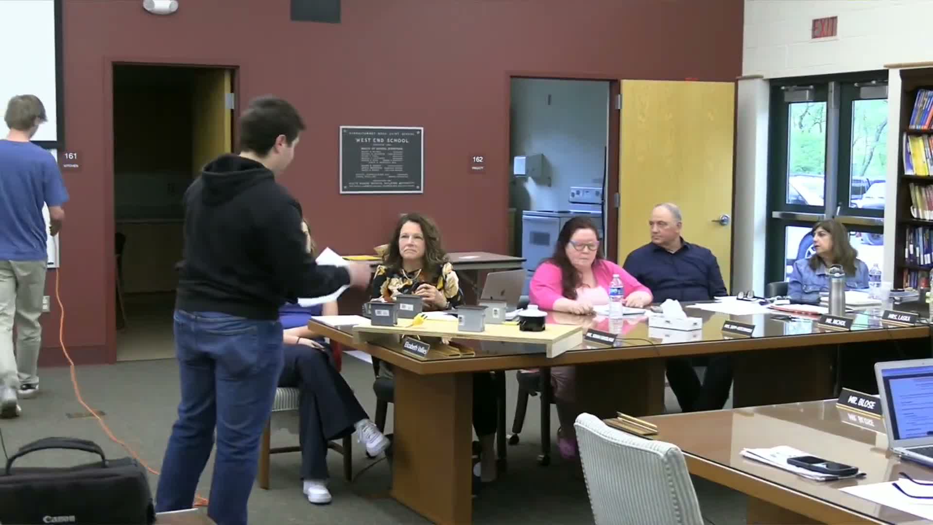 Students showcase construction project and kid-focused community website at board meeting