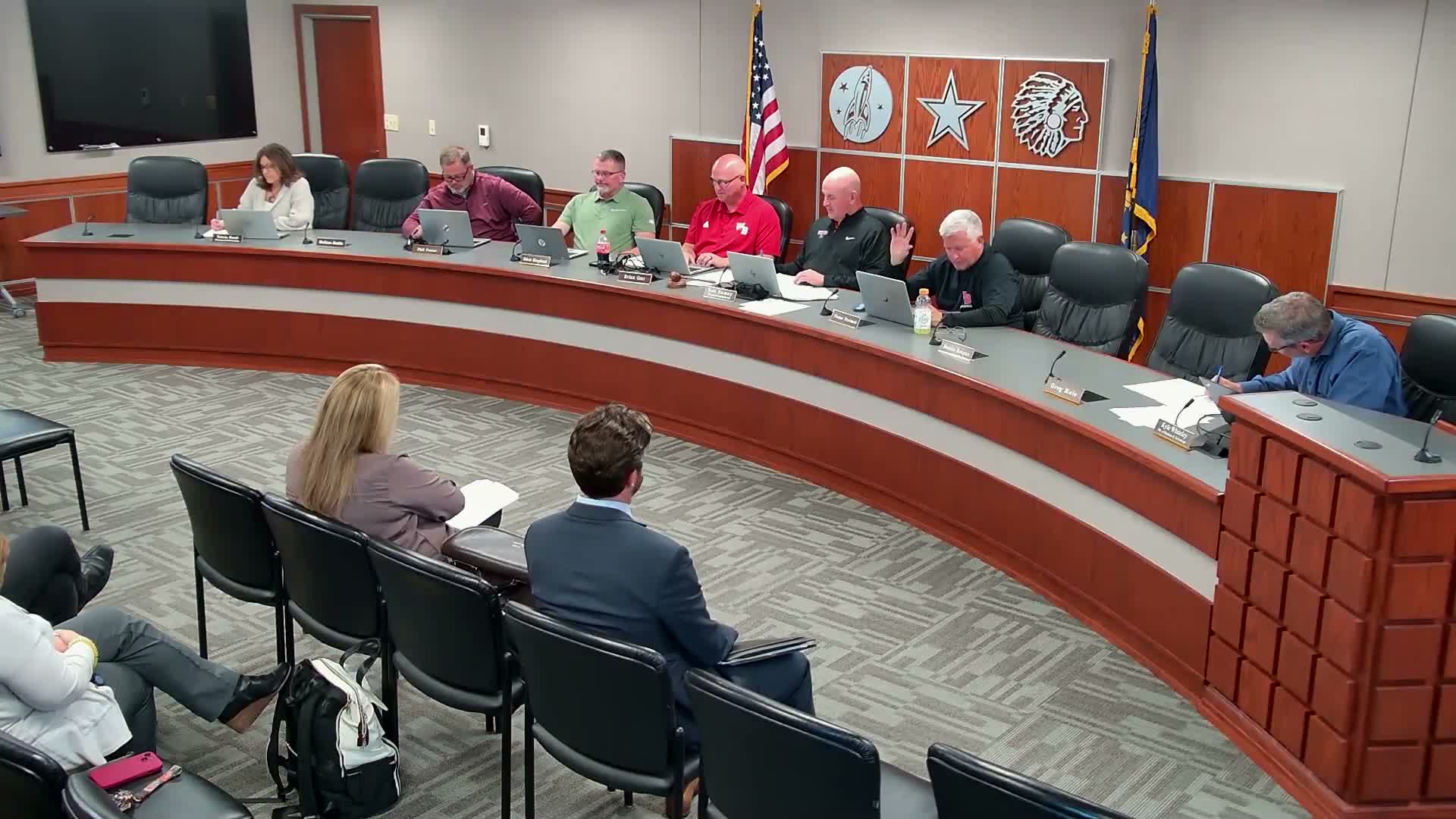 Board approves personnel actions, handbook updates, donation and monthly financial reports