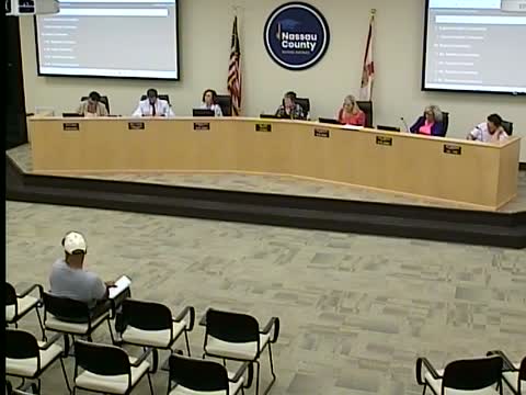 Candidate and parent press Nassau school board on vouchers and discipline in public comment