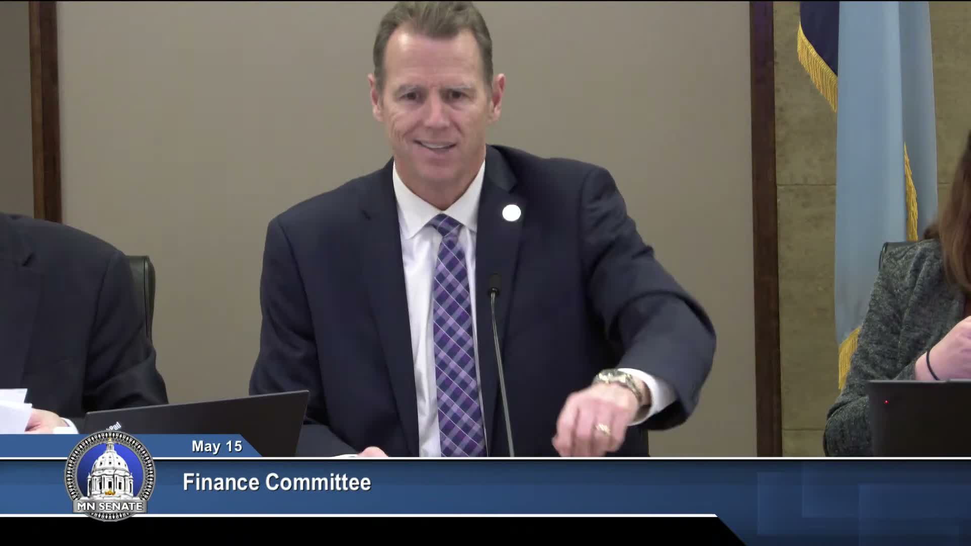 Sen. Wicklund presents negotiated licensing omnibus; committee adopts A26 and sends bill to floor